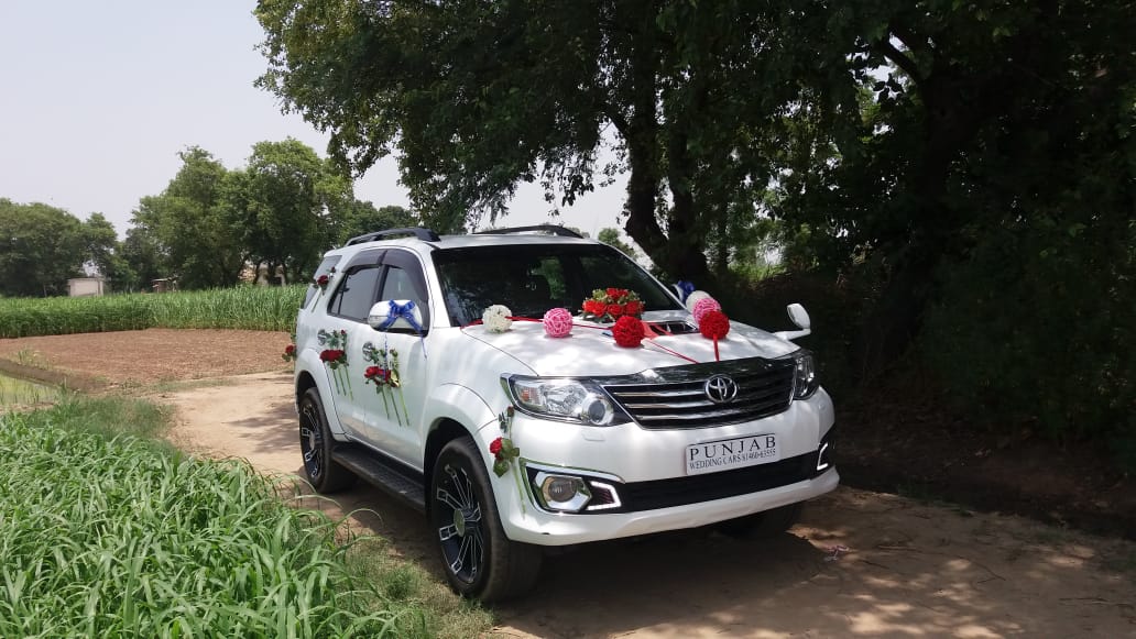 TOYOTA Fortuner White wedding car hire Punjab — Punjab Wedding Cars