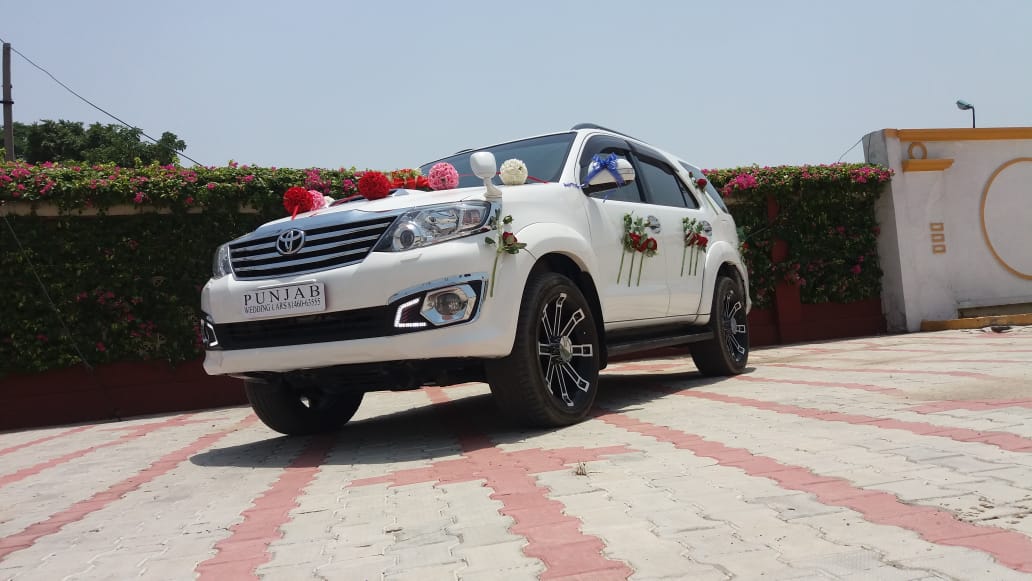 TOYOTA Fortuner White wedding car hire Punjab — Punjab Wedding Cars